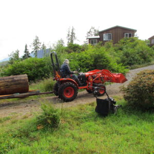 2 tractor hauling a log up