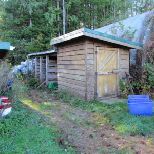 Propane storage, woodsheds and recycling area